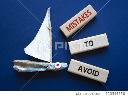 Mistakes to Avoid symbol. Wooden blocks with words Mistakes to Avoid. Beautiful deep blue background with boat. Business and Mistakes to Avoid concept. Copy space. Mistakes to Avoid symbol. Wooden blocks with words Mistakes to Avoid. Beautiful deep blue background with boat. Business and Mistakes to Avoid concept. Copy space. 113545358