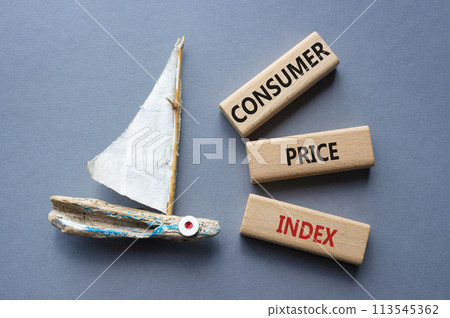 Consumer Price Index symbol. Concept words Consumer Price Index on wooden blocks. Beautiful grey background with boat. Business and Consumer Price Index concept. Copy space. Consumer Price Index symbol. Concept words Consumer Price Index on wooden blocks. Beautiful grey background with boat. Business and Consumer Price Index concept. Copy space. 113545362