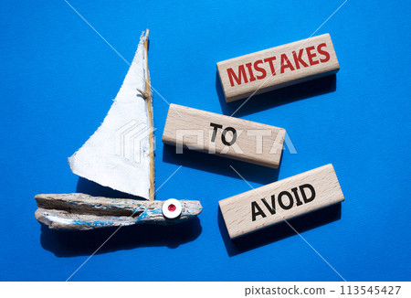Mistakes to Avoid symbol. Wooden blocks with words Mistakes to Avoid. Beautiful blue background with boat. Business and Mistakes to Avoid concept. Copy space. Mistakes to Avoid symbol. Wooden blocks with words Mistakes to Avoid. Beautiful blue background with boat. Business and Mistakes to Avoid concept. Copy space. 113545427