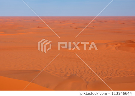Desert. Dunset in desert. Desert in Dubai. The empty quarter and outdoor sand dune in oman old desert rub al khali. Panoramic. Landscape of golden sand dune with blue sky in Sahara desert. Desert. Dunset in desert. Desert in Dubai. The empty quarter and outdoor sand dune in oman old desert rub al khali. Panoramic. Landscape of golden sand dune with blue sky in Sahara desert. 113546644