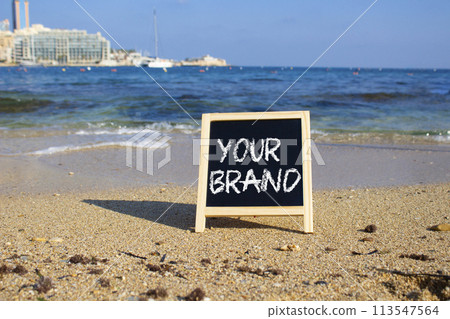 Your Brand symbol. Concept words Your Brand on black chalk background. Beautiful sea background. Business and Your Brand concept. Copy space Your Brand symbol. Concept words Your Brand on black chalk background. Beautiful sea background. Business and Your Brand concept. Copy space 113547564