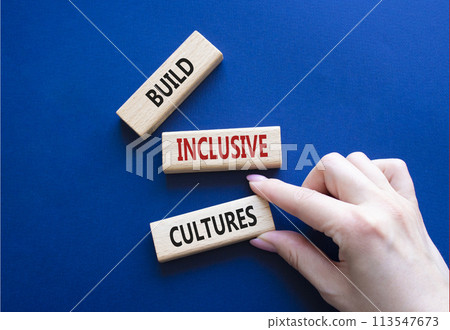 Build Inclusive Cultures symbol. Wooden blocks with words Build Inclusive Cultures. Beautiful deep blue background. Businessman hand. Business and Build Inclusive Cultures. Copy space. Build Inclusive Cultures symbol. Wooden blocks with words Build Inclusive Cultures. Beautiful deep blue background. Businessman hand. Business and Build Inclusive Cultures. Copy space. 113547673