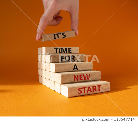 Time for a new start symbol. Wooden blocks with words Time for a new start. Beautiful orange background. Businessman hand. Business and Time for a new start concept. Copy space. Time for a new start symbol. Wooden blocks with words Time for a new start. Beautiful orange background. Businessman hand. Business and Time for a new start concept. Copy space. 113547714