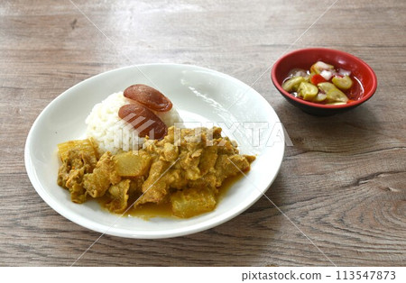 spicy bailed winter melon with pork curry soup eat couple rice on plate dipping sweet chili syrup sauce spicy bailed winter melon with pork curry soup eat couple rice on plate dipping sweet chili syrup sauce 113547873