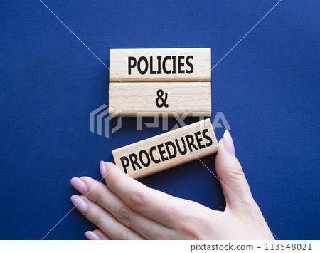 Policies and Procedures symbol. Concept words Policies and Procedures on wooden blocks. Beautiful deep blue background. Businessman hand. Business and Policies and Procedures concept. Copy space. Policies and Procedures symbol. Concept words Policies and Procedures on wooden blocks. Beautiful deep blue background. Businessman hand. Business and Policies and Procedures concept. Copy space. 113548021