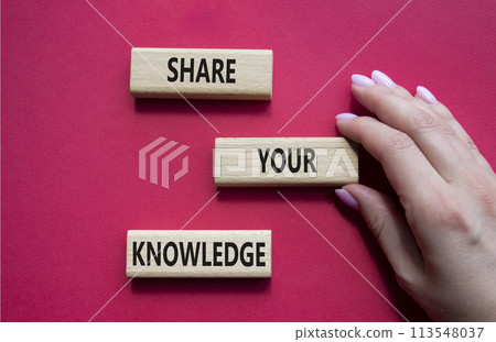 Share your knowledge symbol. Concept word Share your knowledge on wooden blocks. Businessman hand. Beautiful red background. Business and Share your knowledge concept. Copy space 113548037