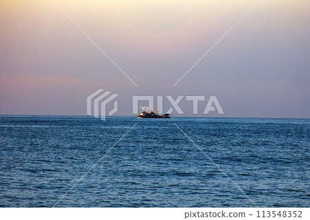 commercial catch fishing far out at sea commercial catch fishing far out at sea 113548352
