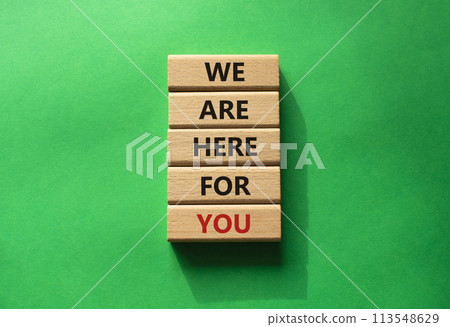 Help symbol. Wooden blocks with words We are here for you. Beautiful green background. Business and We are here for you concept. Copy space. Help symbol. Wooden blocks with words We are here for you. Beautiful green background. Business and We are here for you concept. Copy space. 113548629