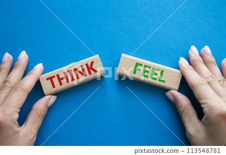 Think or Feel symbol. Concept word Think or Feel on wooden blocks. Businessman hand. Beautiful blue background. Business and Think or Feel concept. Copy space 113548781