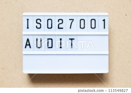 Lightbox with word ISO 270001 audit on wood background 113549827