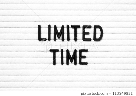 Black color letter in word limited time on white felt board background Black color letter in word limited time on white felt board background 113549831