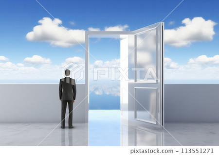 A businessman stands before an open door, symbolizing opportunity and freedom. It's a surreal 113551271