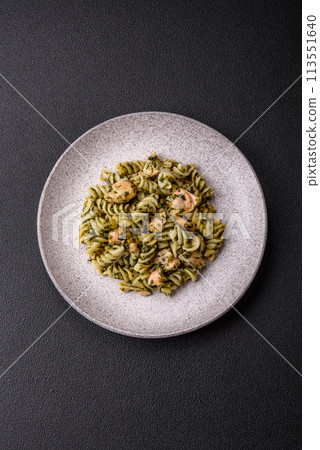 Delicious pasta with spinach, salmon, salt and spices 113551640