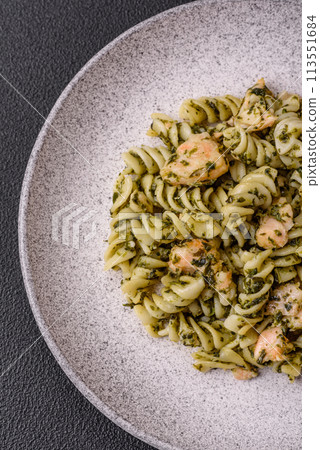Delicious pasta with spinach, salmon, salt and spices Delicious pasta with spinach, salmon, salt and spices 113551684