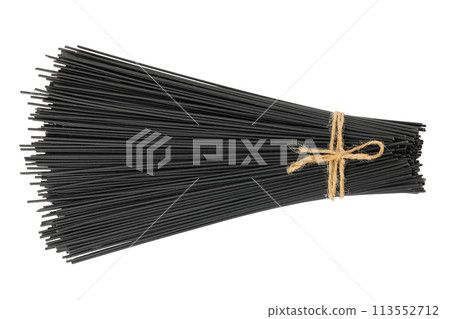 uncooked black spaghetti isolated on white background. Top view. Flat lay uncooked black spaghetti isolated on white background. Top view. Flat lay 113552712