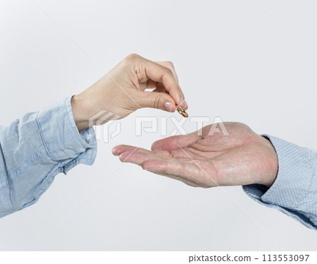 Close-up couple taking wedding rings off Close-up couple taking wedding rings off 113553097