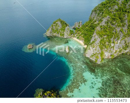 Blue sea and Calachuchi Beach in Coron, Palawan. Philippines. Blue sea and Calachuchi Beach in Coron, Palawan. Philippines. 113553473