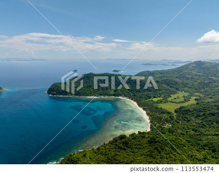 Turquoise clear water and corals in tropical beach with white sand. El Nido, Philippines. Turquoise clear water and corals in tropical beach with white sand. El Nido, Philippines. 113553474