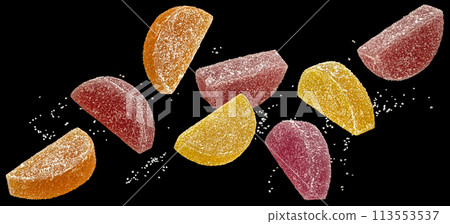 Orange and lemon marmalade candies with sugar, citrus jelly sweets on black background Orange and lemon marmalade candies with sugar, citrus jelly sweets on black background 113553537