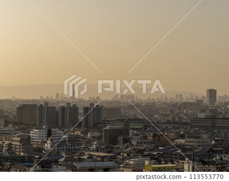 Osaka cityscape covered in yellow sand 113553770