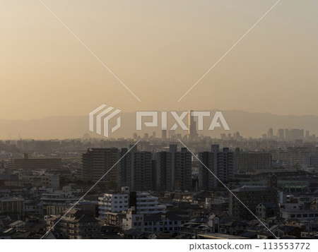 Osaka cityscape covered in yellow sand 113553772