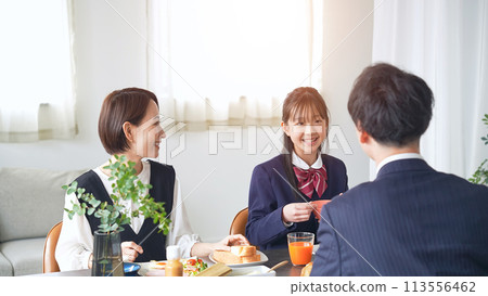 Parent and child talking at the dining table Parent and child talking at the dining table 113556462