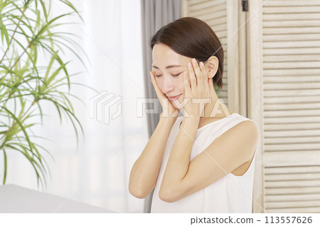 Middle-aged woman doing skin care at home 113557626