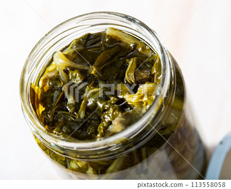 Glass jar with pickled chard Glass jar with pickled chard 113558058