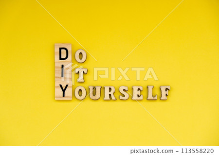 DIY Do It Yourself inscription on yellow background. Handmade home repair decorating handicraft. Tactile creative hobby concept 113558220