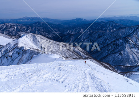 The steep slopes and magnificent mountain ranges of Mt. Tanigawa and Tenjin Ridge in the harsh winter The steep slopes and magnificent mountain ranges of Mt. Tanigawa and Tenjin Ridge in the harsh winter 113558915