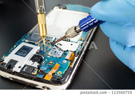 Repairing and upgrade Samsung mobile phone, electronic, computer hardware and technology concept. 113560759
