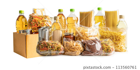 Foodstuff for donation, storage and delivery. Various food, pasta, cooking oil and canned food in cardboard box. Foodstuff for donation, storage and delivery. Various food, pasta, cooking oil and canned food in cardboard box. 113560761
