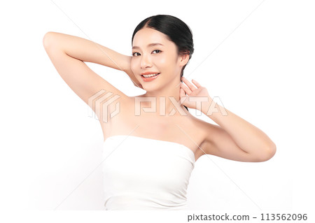 Beautiful Young Asian woman lifting hands up to show off clean and hygienic armpits or underarms on white background, Smooth armpit cleanliness and protection concept 113562096