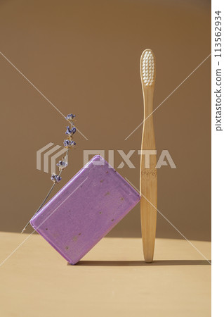 Zero waste bamboo toothbrush and Handcrafted purple lavender soap with lavender flowers. Natural hydrating moisturiser softness cosmetic. Organic calming beauty skincare product. Herbal self care 113562934