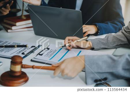 Businessman and lawyer discuss the contract document. Treaty of the law. Sign a contract business. 113564434