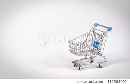 Small shopping cart isolated on solid background Small shopping cart isolated on solid background 113565001