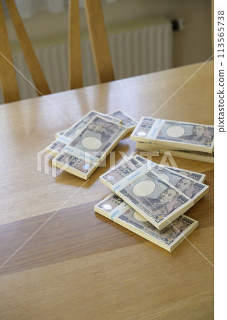 A stack of bills on a desk A stack of bills on a desk 113565738