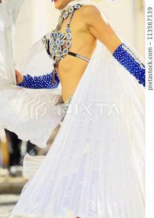 Brazilian costumes dancing samba on the streets of the city 113567139