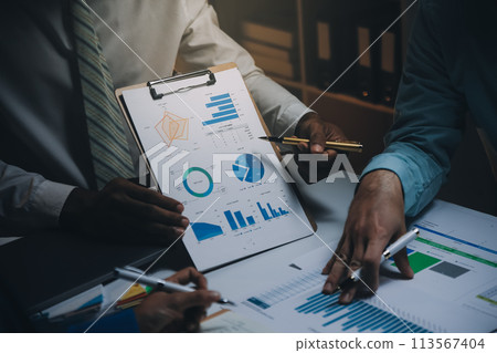 Business team meeting present, investor colleagues consultation and conference new strategy plan business and market growth on financial document graph report, Meeting and Talking. Business team meeting present, investor colleagues consultation and conference new strategy plan business and market growth on financial document graph report, Meeting and Talking. 113567404