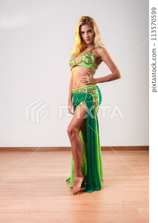 Young blonde belly dancer looking at the camera 113570599