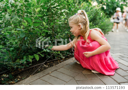 Child head with cochlear implant hearing aid. Hearing aid and medicine innovating technology and diversity inclusion concept. Copy space Child head with cochlear implant hearing aid. Hearing aid and medicine innovating technology and diversity inclusion concept. Copy space 113571193