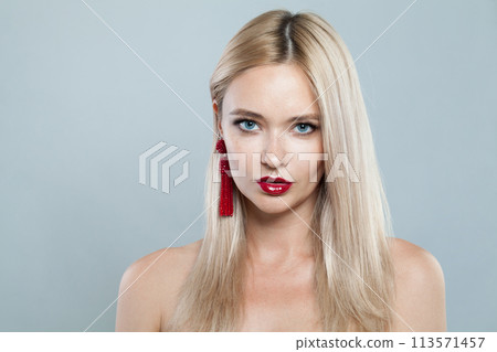 Glamorous young blonde lady with fresh clear skin and long smooth straight hairstile on white  113571457