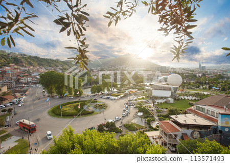 Beautiful panoramic landscape of old city in Tbilisi on the background of blue cloudy sky Beautiful panoramic landscape of old city in Tbilisi on the background of blue cloudy sky 113571493
