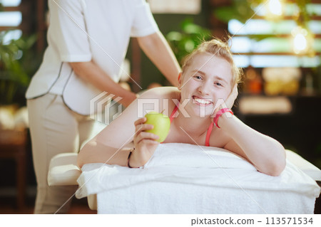 massage therapist woman in massage cabinet making massage 113571534