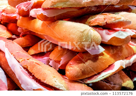 Tapas and pinchos at a food market in Spain. Traditional Spanish gastronomy Tapas and pinchos at a food market in Spain. Traditional Spanish gastronomy 113572176