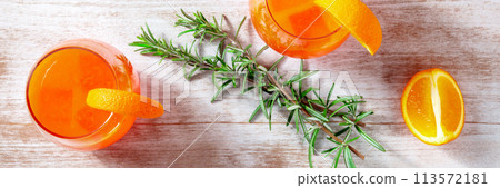 Orange cocktails with rosemary panorama, overhead flat lay shot Orange cocktails with rosemary panorama, overhead flat lay shot 113572181
