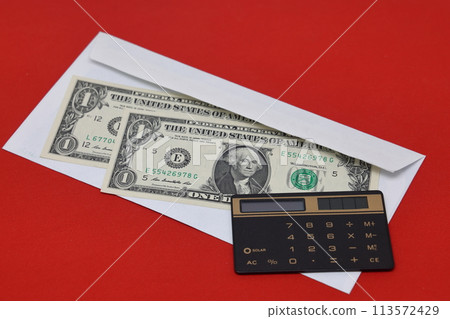 Calculator and banknotes in a white envelope on a red background. Bribery concept. Calculator and banknotes in a white envelope on a red background. Bribery concept. 113572429