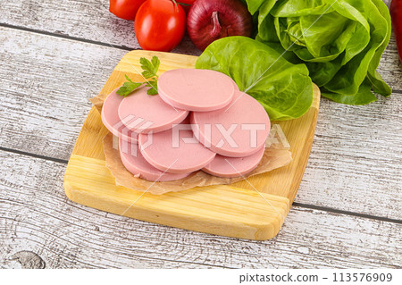 Slices boiled sausages for breakfast 113576909