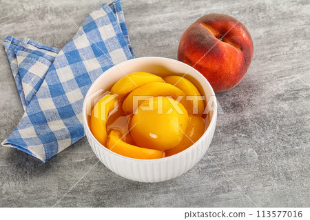Ripe sweet and juicy canned peach 113577016