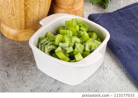 Vegan cuisine - Sliced celery stem Vegan cuisine - Sliced celery stem 113577035
